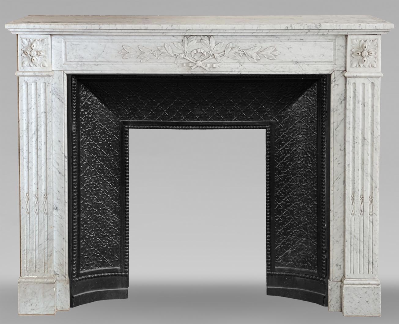 louis-xvi-style-mantel-in-carrara-marble-Marc Maison - ultimate neoclassical fireplace mantel
