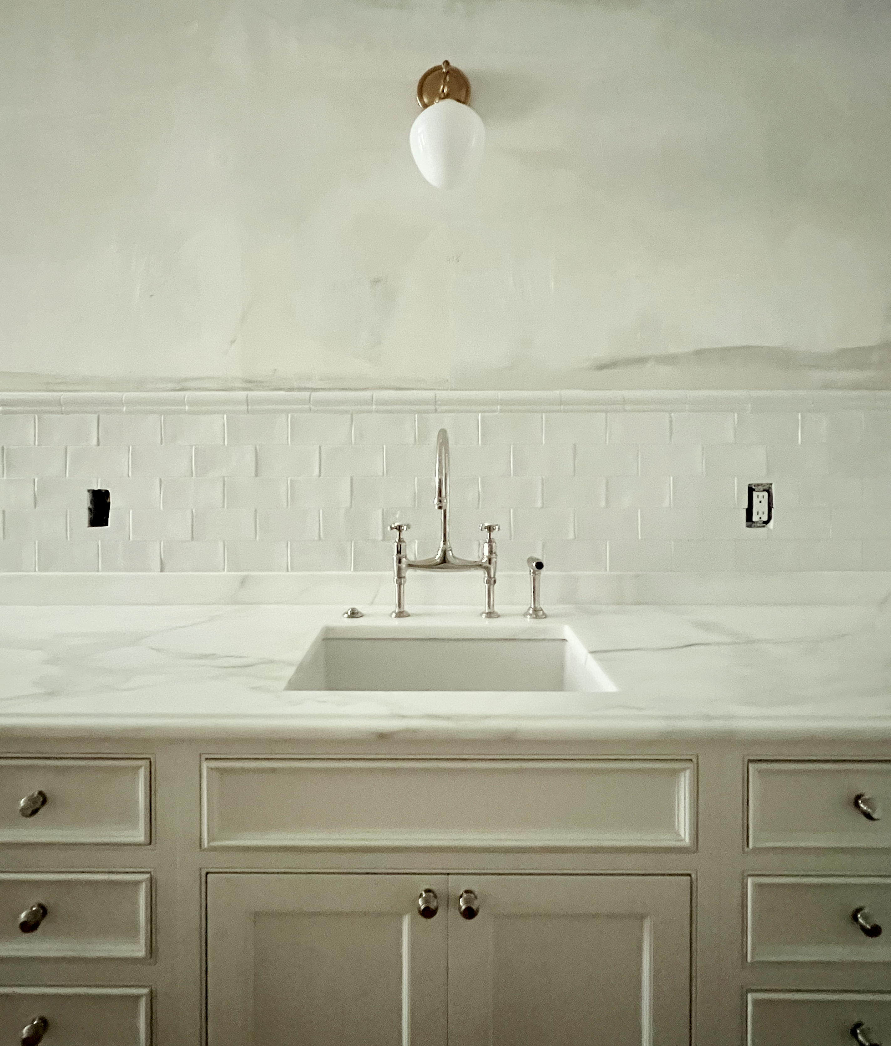 subway tile - white grout - sink wall 