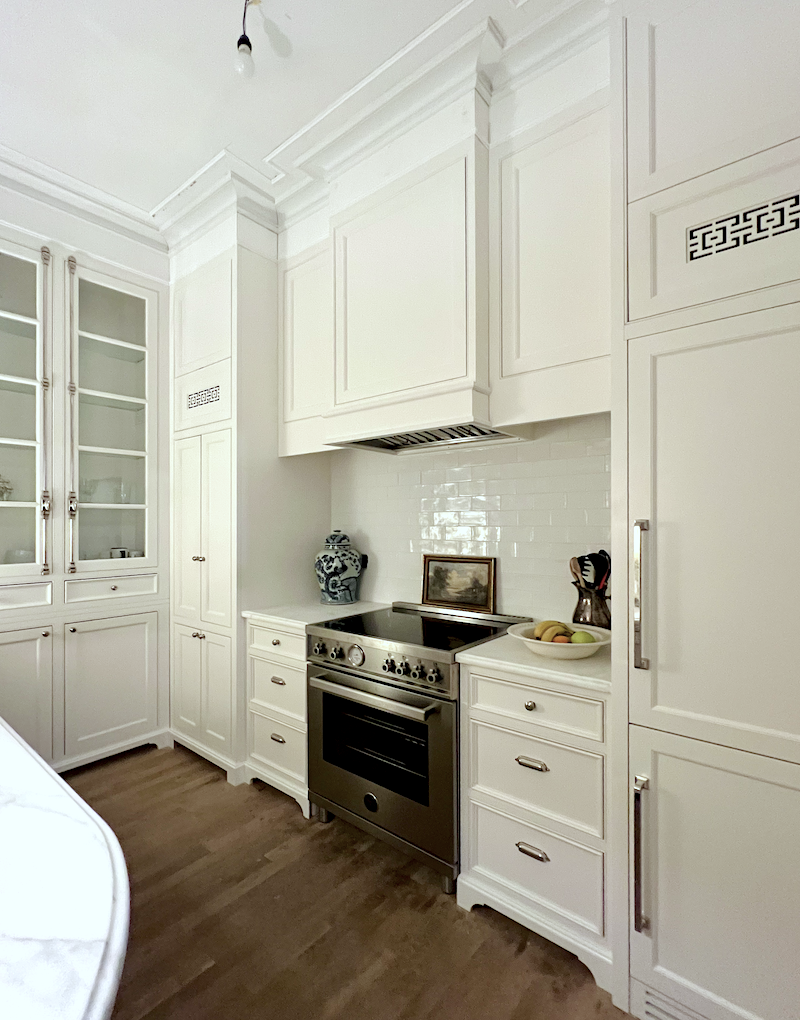 range wall in my new kitchen with newly installed fridge panel and toe kicks