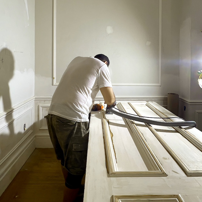 Sergio sanding a 144 year old door