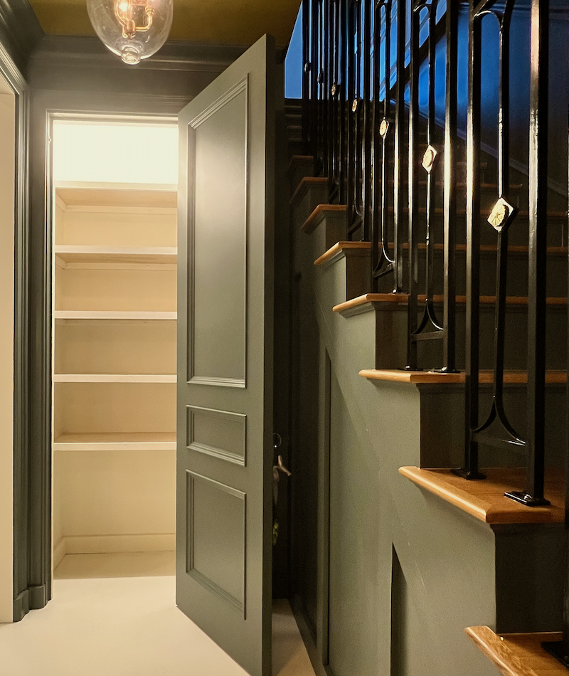 linen closet shelves with staircase