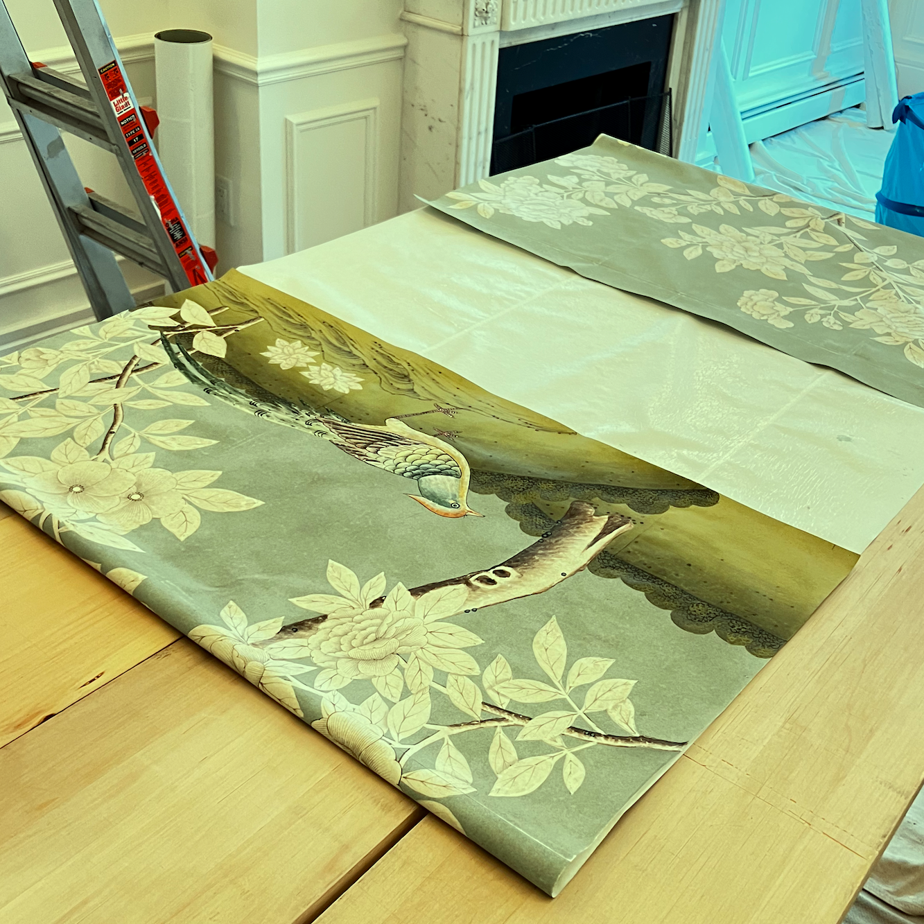 Gracie wallpaper panel getting ready to hang