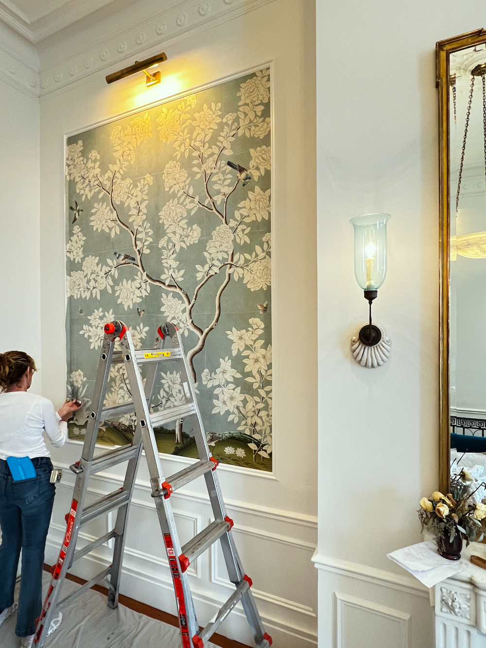 Melanie doing final trim Gracie wallpaper panels