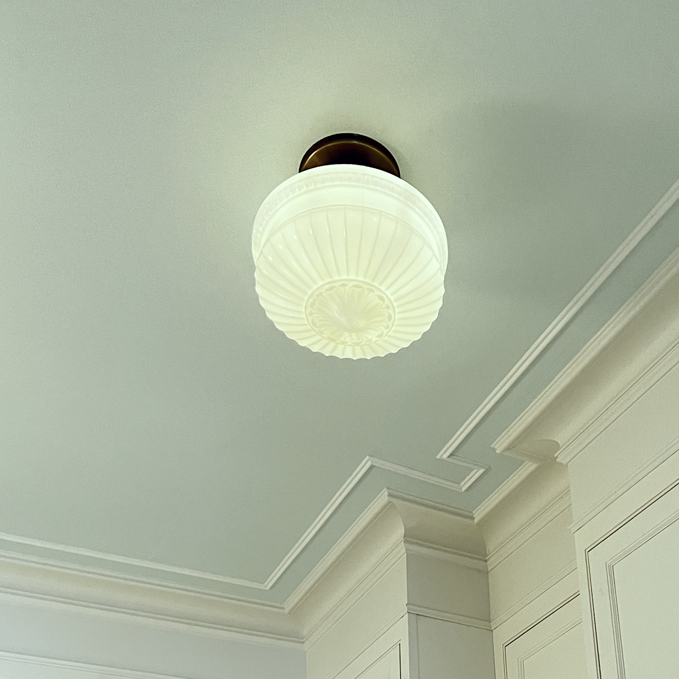 fluted kitchen milk glass semi-flushmount fixture. Benjamin Moore Italian Ice Green ceiling. Cabinetry by Crown Point