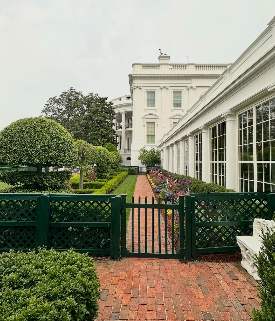 via Christopher Spitzmiller, a view of the Jacqueline Kennedy garden and former east wing colonnade