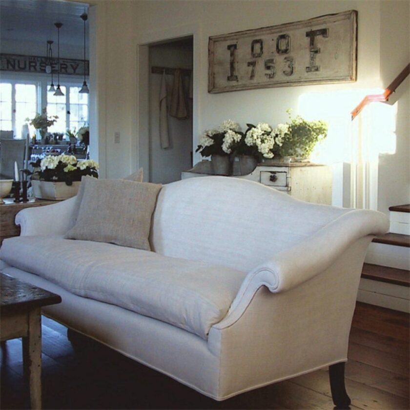Beautiful Chippendale camelback sofa in beige linen