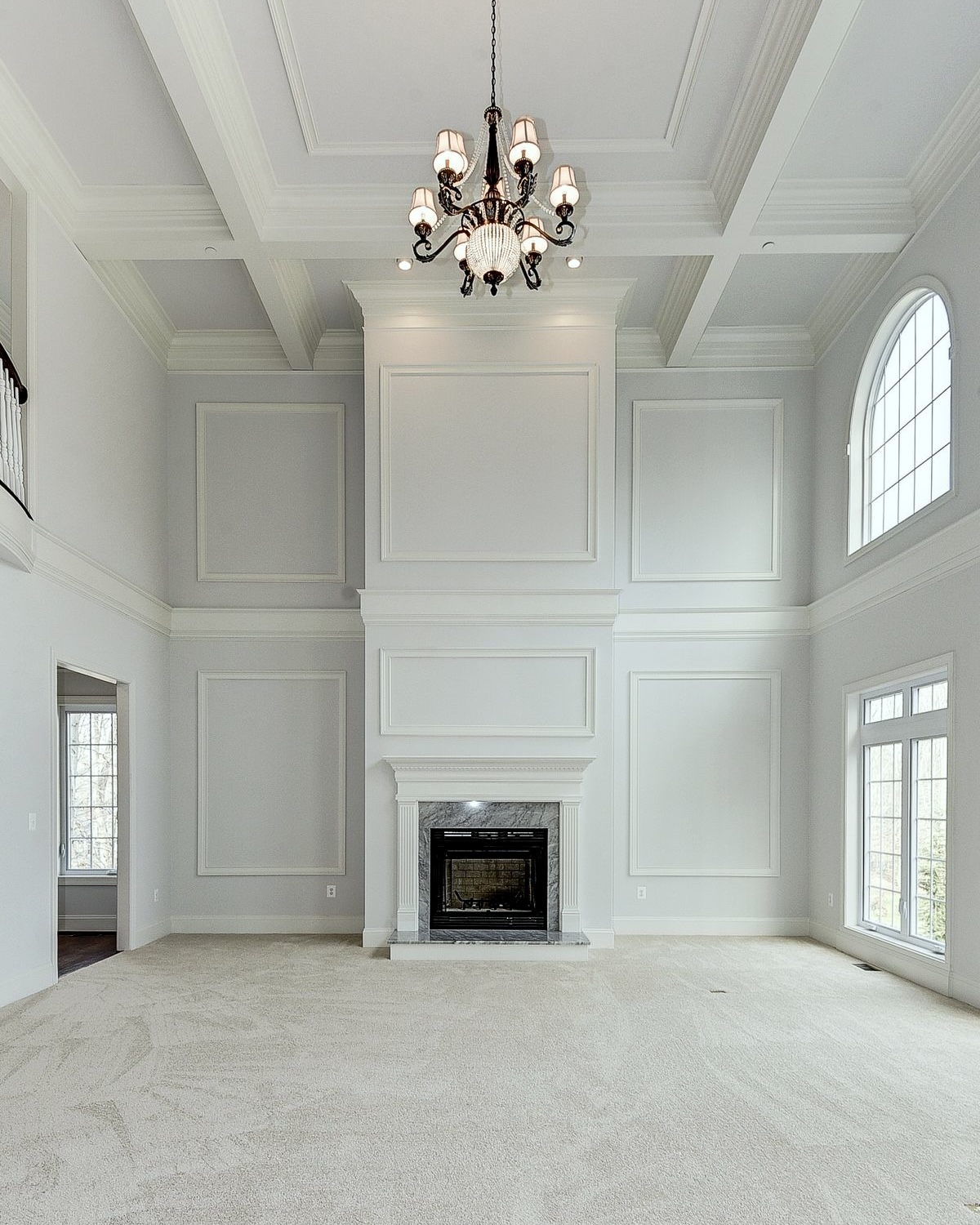 moulding + frieze horizontal element two-story great room - adds a natural stopping point